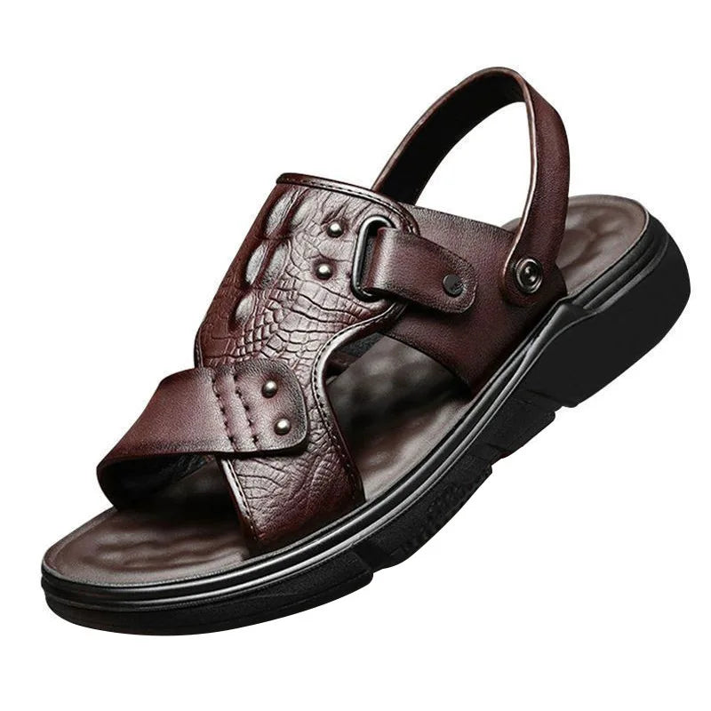 Brown leather sandal with crocodile texture on a white background