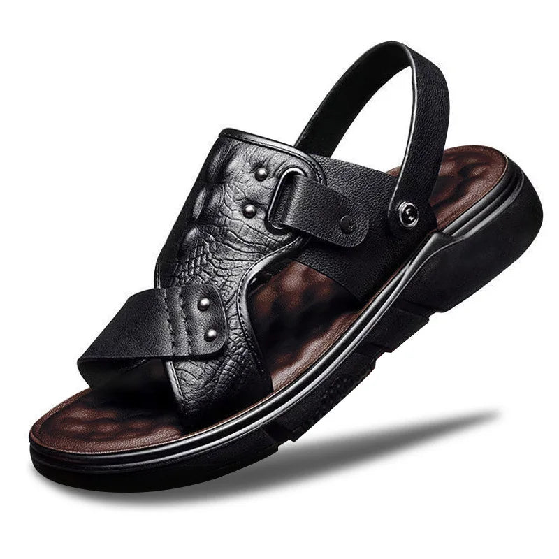 Black leather sandal with brown soles on a white background