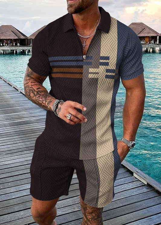 Man wearing a patterned shirt and shorts by a waterfront